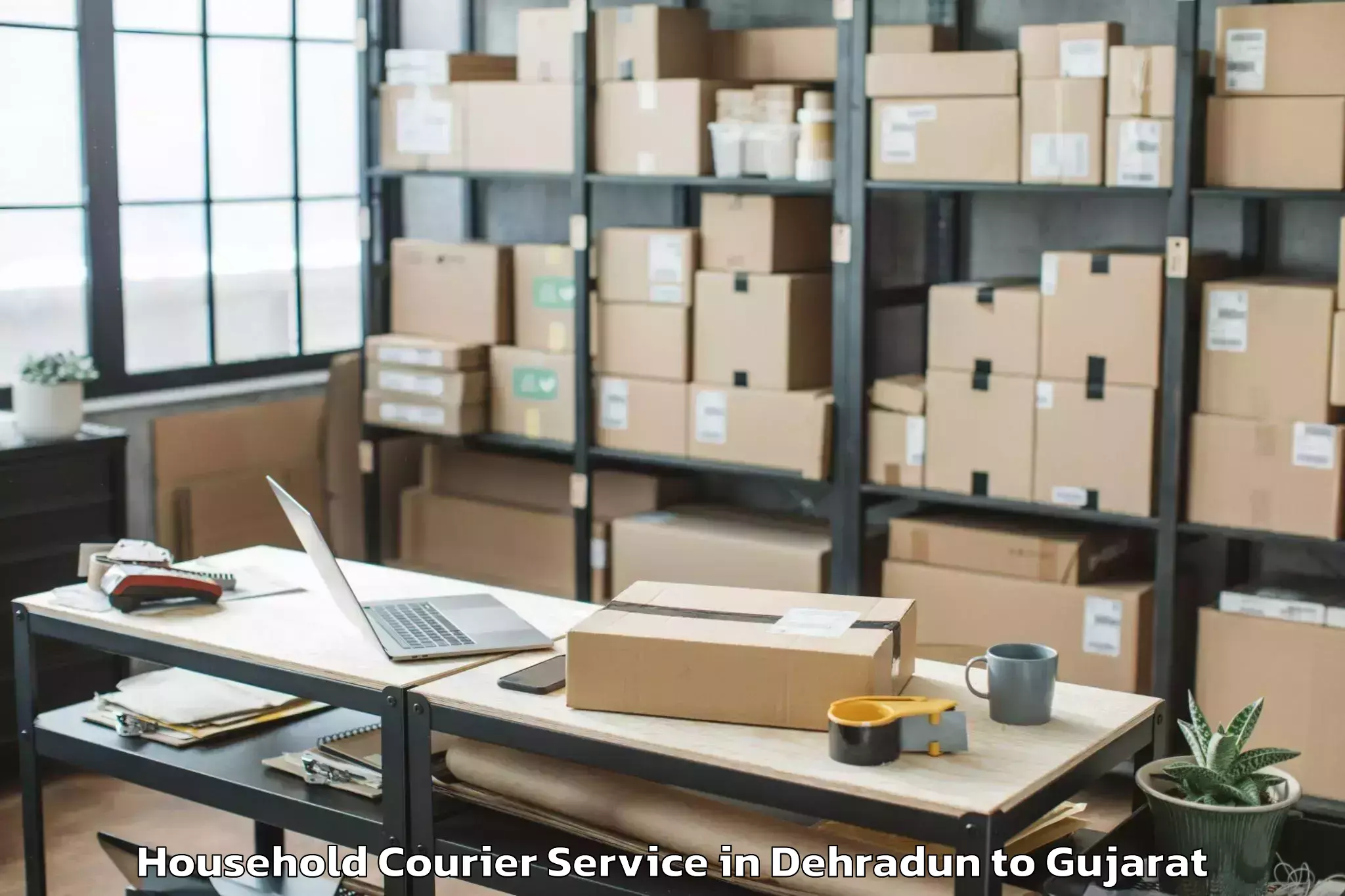 Top Dehradun to Khambhaliya Household Courier Available